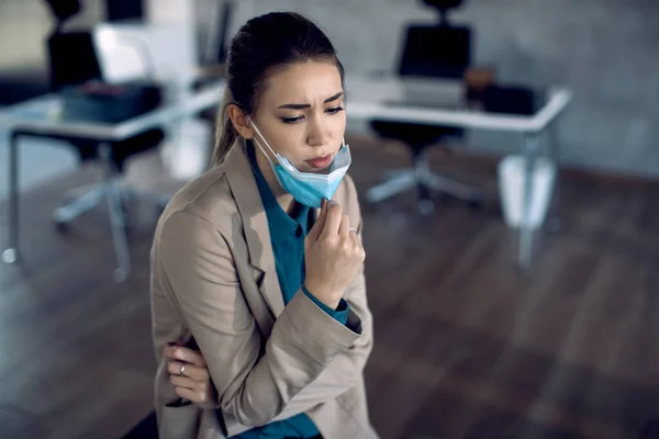 Young Displeased Businesswoman Taking Protective Face Mask While Working Office — 스톡 사진