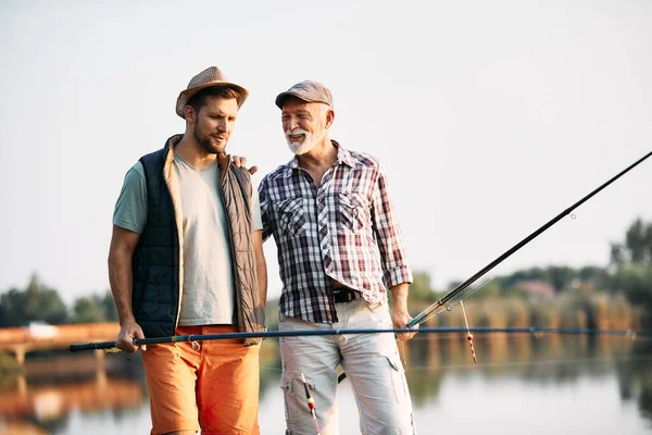 Happy Senior Man Talking His Son Fishing River Nature — 图库照片