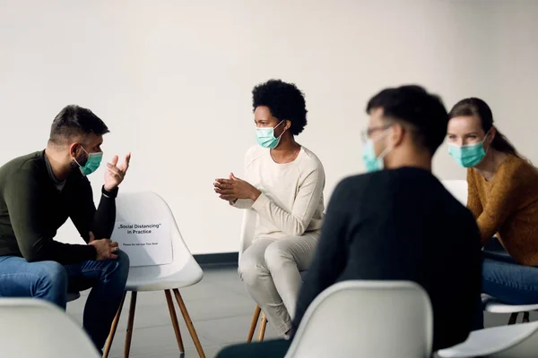 Group Therapy Participants Talking While Wearing Face Masks Due Coronavirus — 스톡 사진