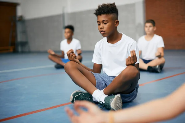 African American Schoolboy His Friends Meditating Lotus Position Class School — Fotografia de Stock