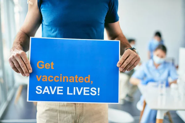 Unrecognizable Man Holding Placard Get Vaccinated Lives Message Coronavirus Immunization — Zdjęcie stockowe