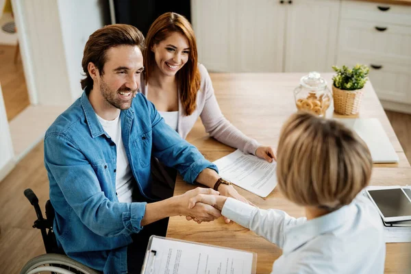 Happy Man Wheelchair Shaking Hands Financial Advisor While Being Meeting — Fotografia de Stock