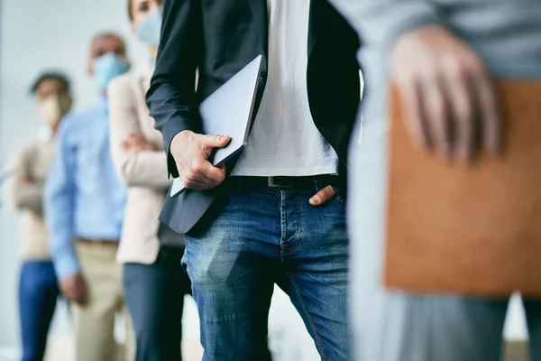 Unrecognizable Male Entrepreneur Holding His Laptop While Standing Row Group — Photo