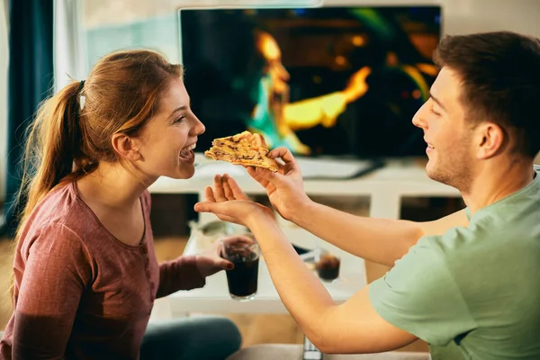 Happy Woman Having Fun While Boyfriend Feeding Her Pith Pizza — Stockfoto