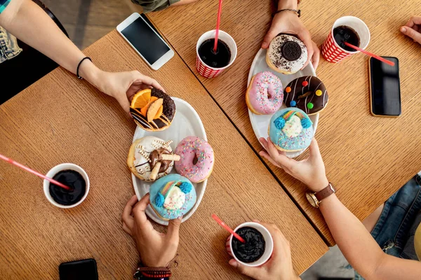 Close Group Friends Having Glazed Donuts Dessert While Sitting Cafe — Photo