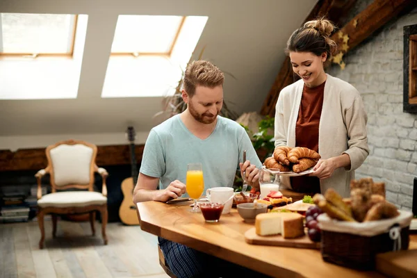 Young Couple Having Breakfast Dining Table Morning Happy Woman Serving —  Fotos de Stock