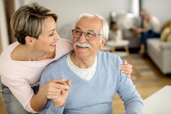 Happy Woman Her Senior Father Holding Hands While Communicating Home — Photo