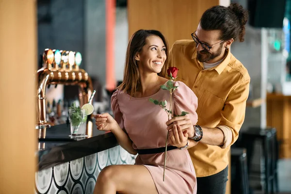 Young Happy Woman Sitting Bar Counter Receiving Red Rose Her — Photo