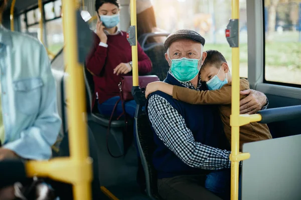 Distraught Grandfather Holding His Sad Grandson While Commuting Bus Coronavirus — 图库照片