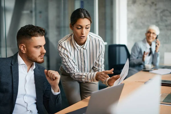 Young Businesswoman Her Coworker Examining Reports While Working Corporate Office — Stock Fotó