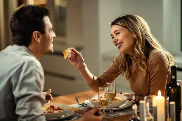Happy Woman Having Fun While Feeding Her Boyfriend Dinner Dining — стоковое фото