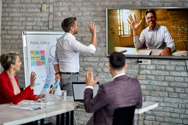Happy Businessman Having Video Conference Greeting His Team Who Working — Fotografia de Stock