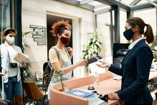 Female Tourist Protective Face Mask Giving Passport Receptionist While Checking — Foto Stock