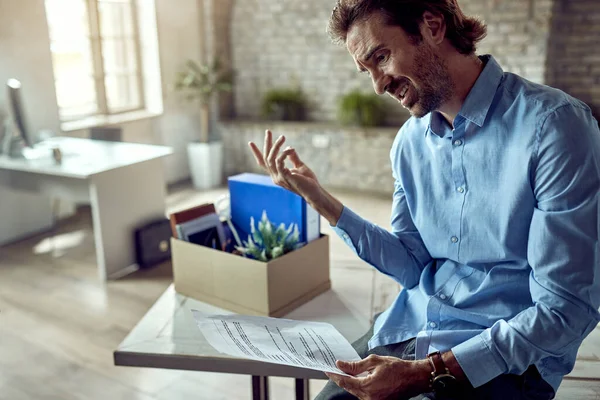 Young Displeased Businessman Analyzing Notice Being Fired Office — Photo