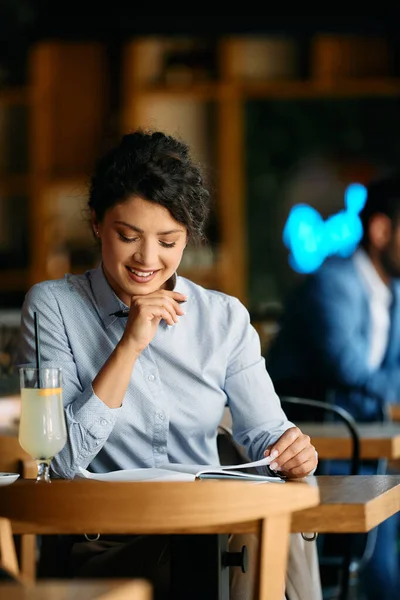 Young Happy Businesswoman Going Her Notes While Relaxing Cafe — Stockfoto