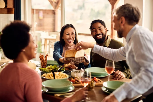 Group Cheerful Friends Laughing While Having Lunch Together Dining Room — Foto de Stock