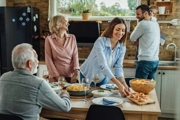 Happy Woman Brining Food Table While Having Family Lunch Dining — Stock Fotó