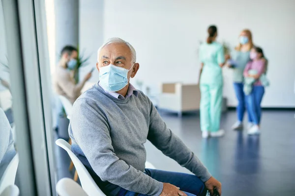 Distraught Senior Man Protective Face Mask Sitting Waiting Room Medical — 스톡 사진