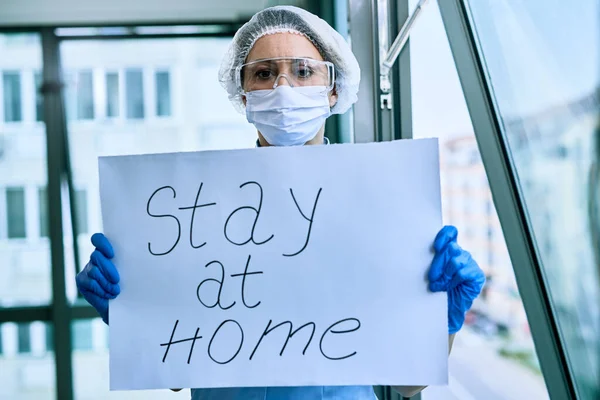 Female Doctor Holding Placard Stay Home Text Appeal Covid Epidemic — 스톡 사진
