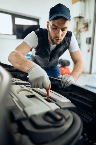 Young Mechanic Checking Oil Level Car Engine Repair Workshop — Stock fotografie