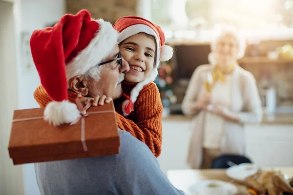 Joyful Granddaughter Grandfather Embracing Exchanging Gifts Christmas Day Home — Foto Stock