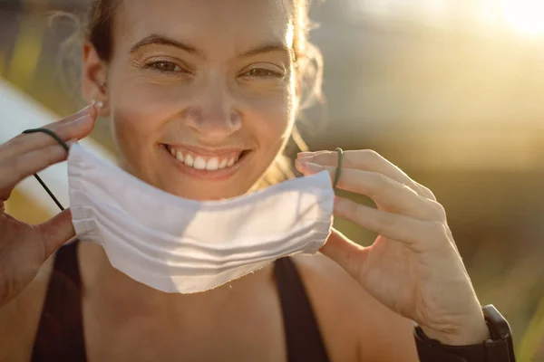 Close Happy Athletic Woman Putting Protective Face Mask Outdoors — Photo