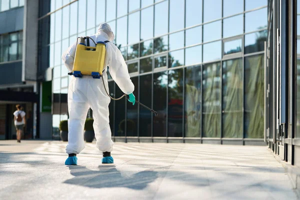 Back View Man Hazmat Suit Disinfecting City Streets Coronavirus Pandemic — Stock fotografie