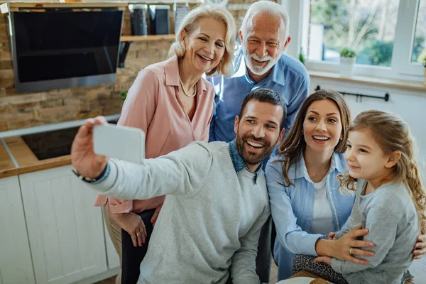 Cheerful Multi Generation Family Taking Selfie Having Fun Together Home — Stock Fotó