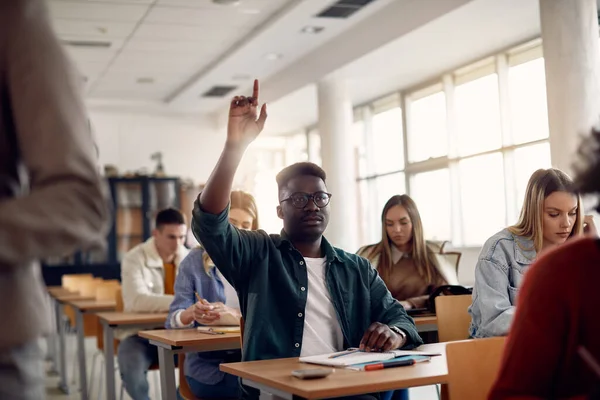 Black University Student Raising His Arm Answer Question While Having —  Fotos de Stock