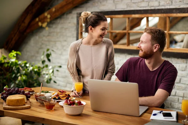 Happy Man Using Computer Talking His Girlfriend Having Breakfast Dining — Photo