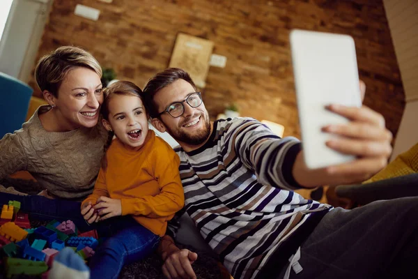 Happy Family Using Digital Tablet Having Fun While Taking Selfie — Stock Fotó
