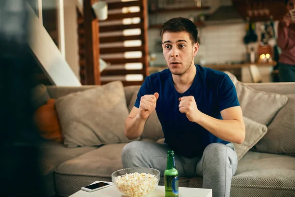 Young Man Anticipating Victory His Favorite Team While Watching Sports — стоковое фото