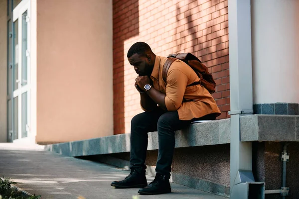 Young Distraught African American Student Sitting Campus Thinking Something — Stok fotoğraf