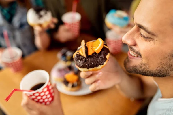 Close Happy Man Having Dessert Friends Eating Orange Chocolate Donut — Photo
