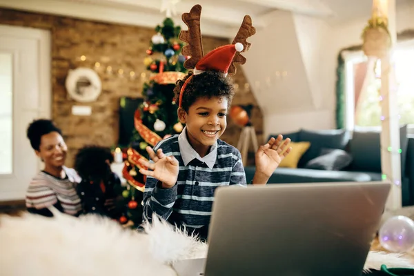 Joyful Black Boy Using Laptop Greeting Someone Video Call Christmas — ストック写真
