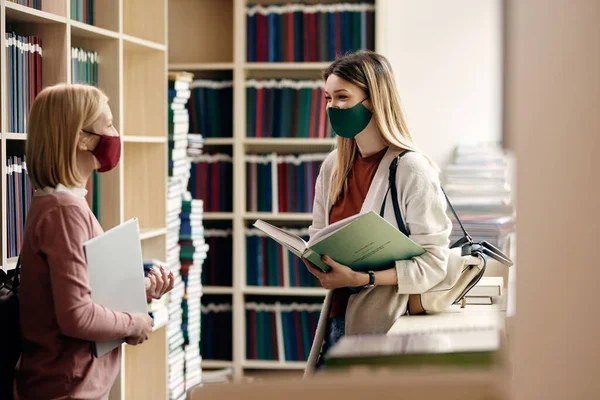Young Happy Women Wearing Protective Face Masks Talking While Learning — Stok Foto