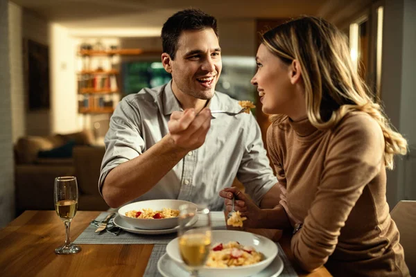 Happy Couple Having Fun Meal Dining Table Man Feeding His — стокове фото