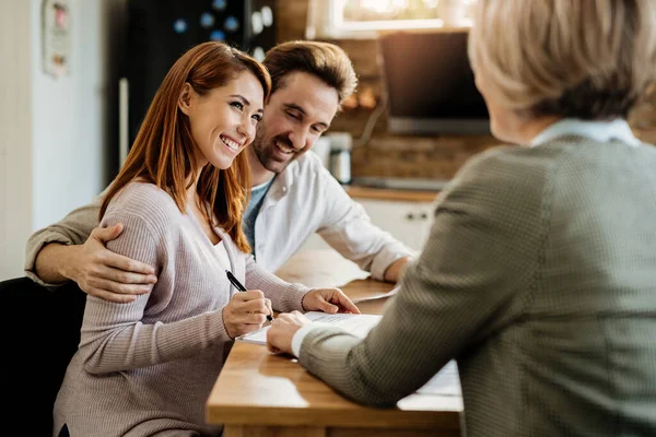 Young Happy Woman Her Husband Signing Agreement Insurance Agent Meeting — 스톡 사진