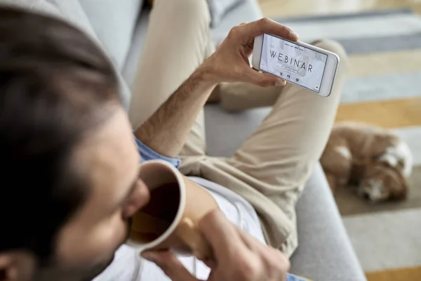 Close Man Using Smart Phone Webinar While Drinking Coffee Home — 图库照片