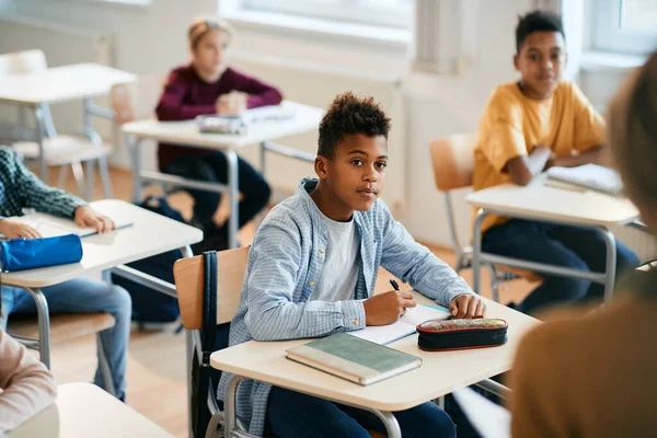 Black Schoolboy Paying Attention Taking Notes Class Elementary School — Stock Fotó