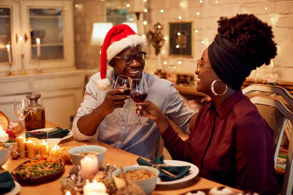 Young African American Couple Toasting Wine Dinner While Celebrating Christmas — Stockfoto