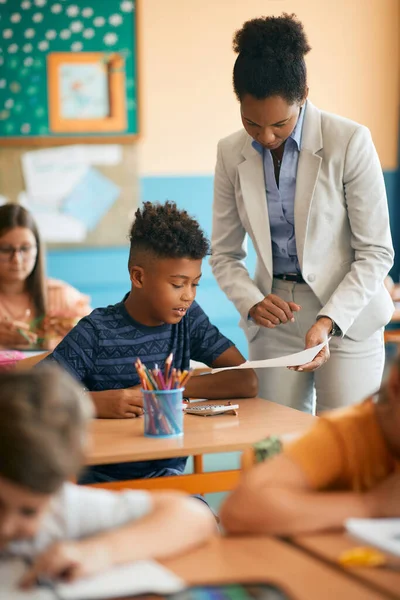 African American Elementary Student His Teacher Analyzing Test Results Class — Stok Foto