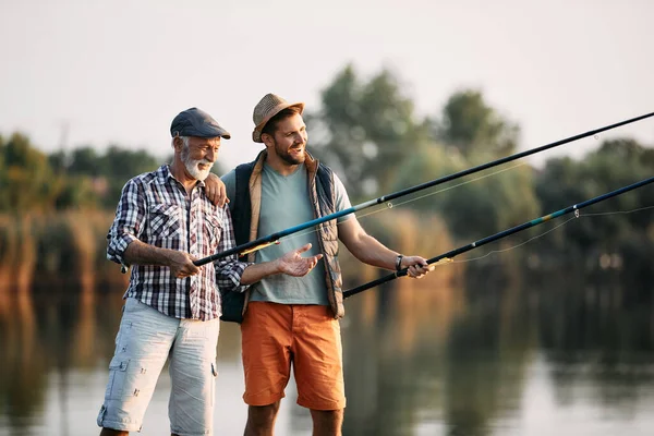 Happy Man His Senior Father Fishing While Spending Time Together — Stok fotoğraf