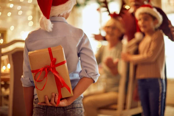 Back View Little Boy Surprising His Family Christmas Gift While — ストック写真