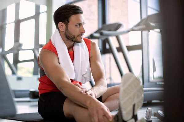 Young Athletic Man Stretching Floor While Exercising Gym — ストック写真