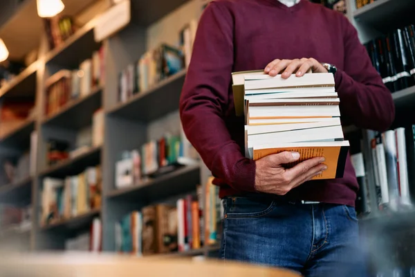 Unrecognizable Mature Student Carrying Stack Book While Doing Research Library — Stockfoto