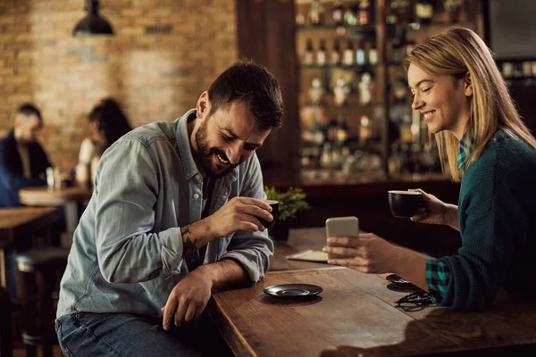 Happy Couple Reading Something Funny Smart Phone While Drinking Coffee — Foto de Stock