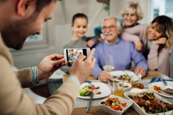 Close Father Using Cell Phone Taking Picture His Multi Generation — Zdjęcie stockowe