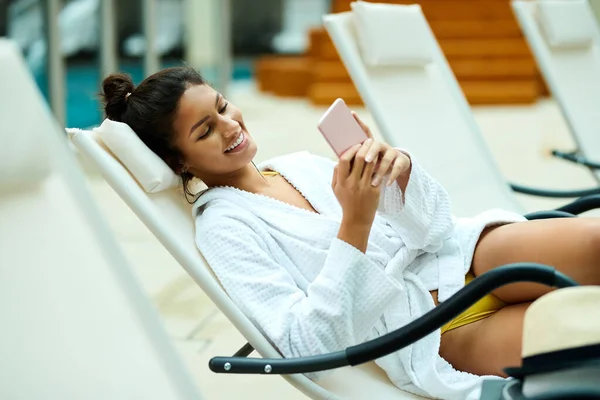 Young Happy Woman Bathrobe Using Smart Phone While Relaxing Pool — Stockfoto