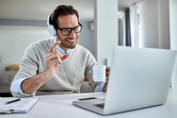 Happy Entrepreneur Drinking Coffee While Using Computer Having Video Conference — Stockfoto